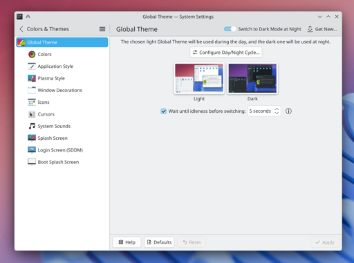 Screenshot of System Settings showing the day/night global theme chooser.